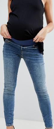 asos design maternity ridley high waist skinny jeans with under the bump waistband  extreme mid wash