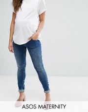 ridley skinny jean  mid wash with over the bump waistband