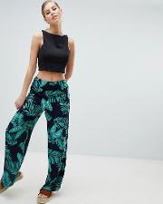 palm print relaxed trousers