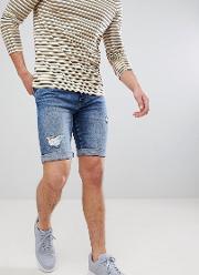 regular fit denim shorts with rips in mid wash