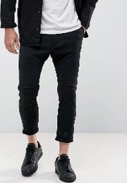 cropped drop crotch trousers in black