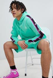 pullover hoodie with taped side stripes in green 10007588 a04