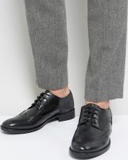 brogues in black leather