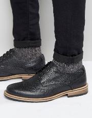 milled brogues in black leather