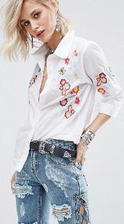 oversized shirt with floral embroidery