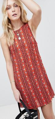 sleeveless shift dress with tie back in tile print