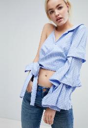 one shoulder top with extreme ruffle sleeve and wrap waist in grid check