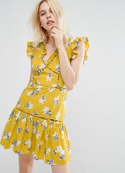 sleeveless tea dress with ruffle details in vintage floral