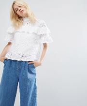 tiered top with high neck in broderie lace