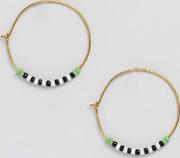 gold hoop earrings with bead detail
