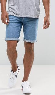 man denim shorts in mid wash blue