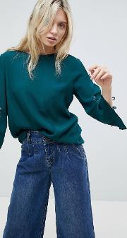 embroidered sleeve top