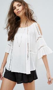 cold shoulder drapey top with lace trim
