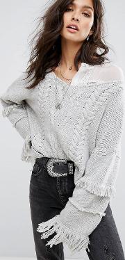 cable knit jumper with tassel detail