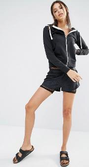 shorts in embossed snake print with exposed waistband