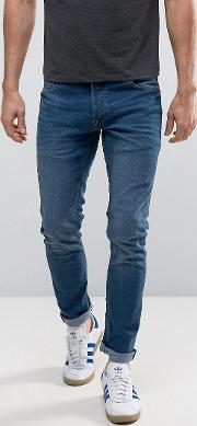 slim fit jeans in mid blue wash with stretch