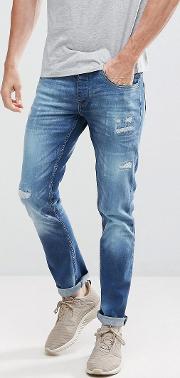 tapered fit jeans with distressing