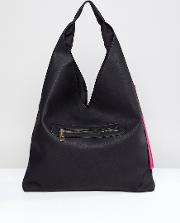 slouchy shoulder bag in black with tassel