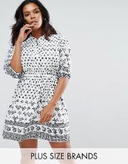 belted dress in border print