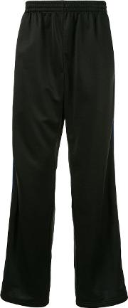 Tracksuit Pants With Side Stripes Have An Elastic Belt 
